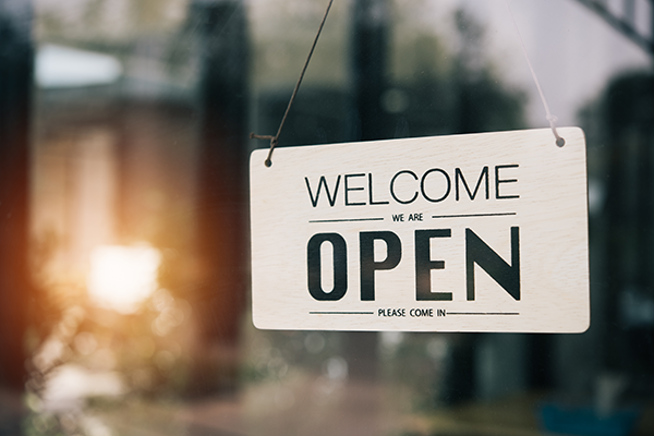 open sign hanging in window