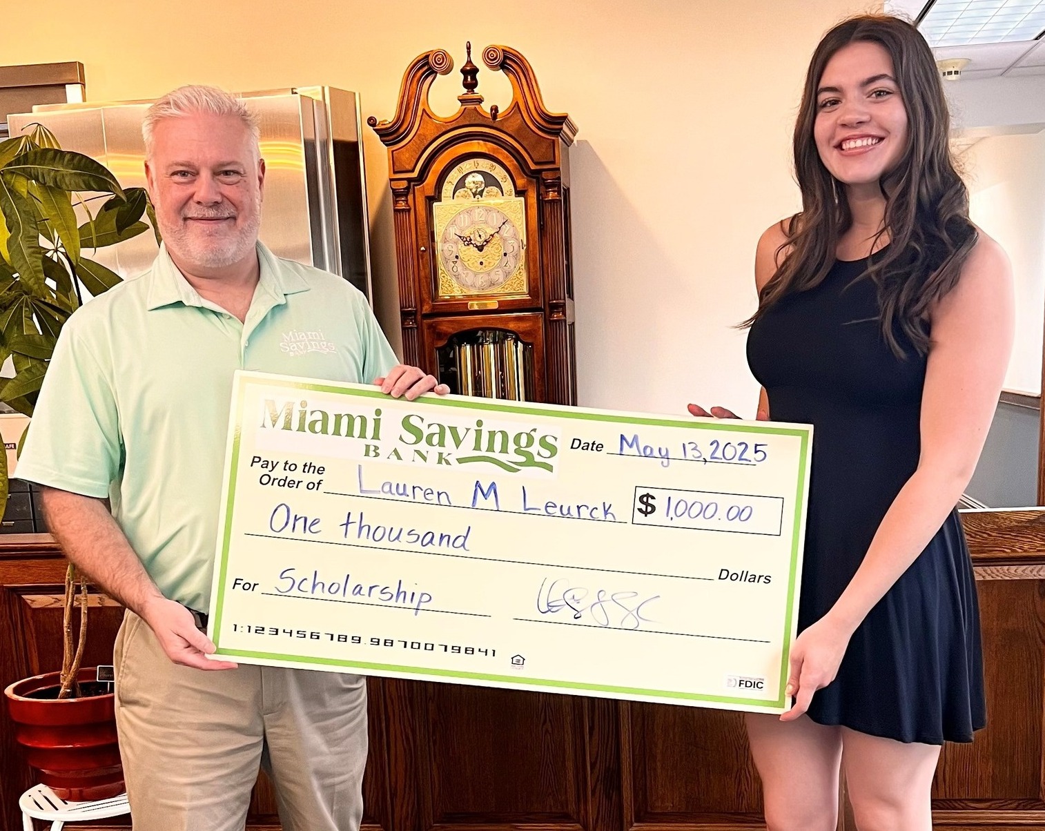 2025 Scholarship winner standing next to president of bank